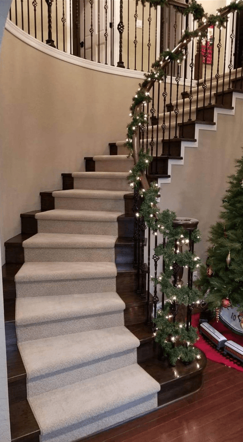 Custom carpet stair installation with curved staircase